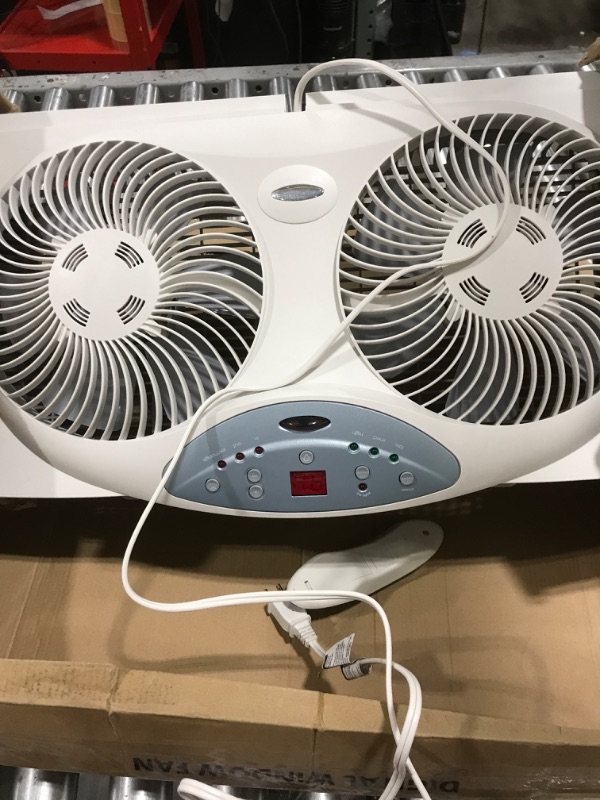 Photo 3 of Bionaire Window Fan with Twin 8.5-Inch Reversible Airflow Blades and Remote Control, White White 2 Blades Electronic control with LCD screen Window Fan