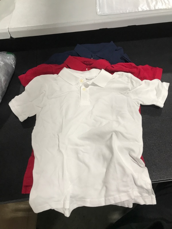 Photo 1 of youth size medium polos