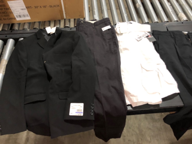 Photo 1 of Men's clothing small and medium. Includes underwear and socks.