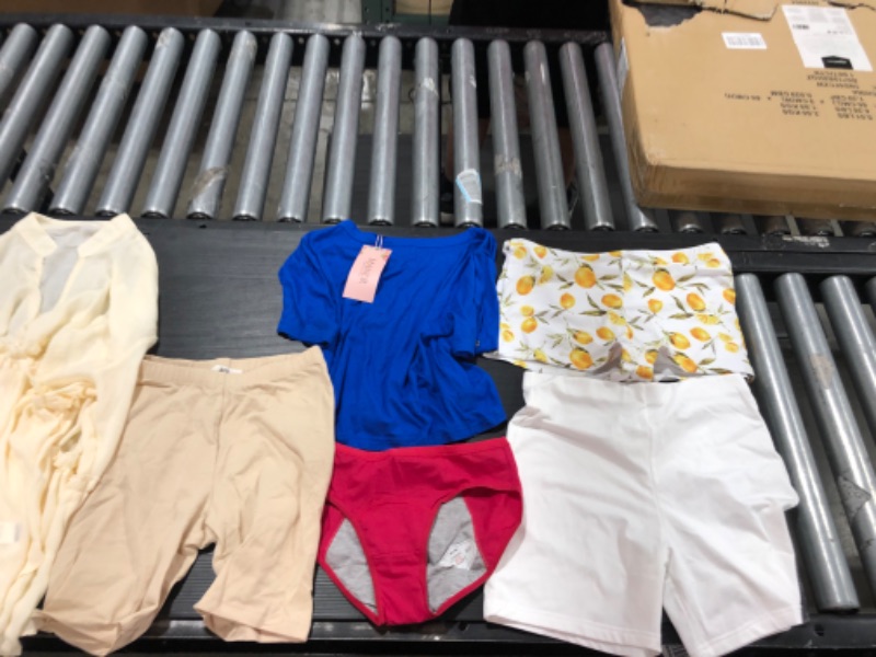 Photo 1 of Women's small and medium clothing including underwear and bathing suits. 