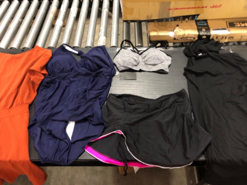 Photo 1 of Women's XL and L clothing including swim suits and underwear.
