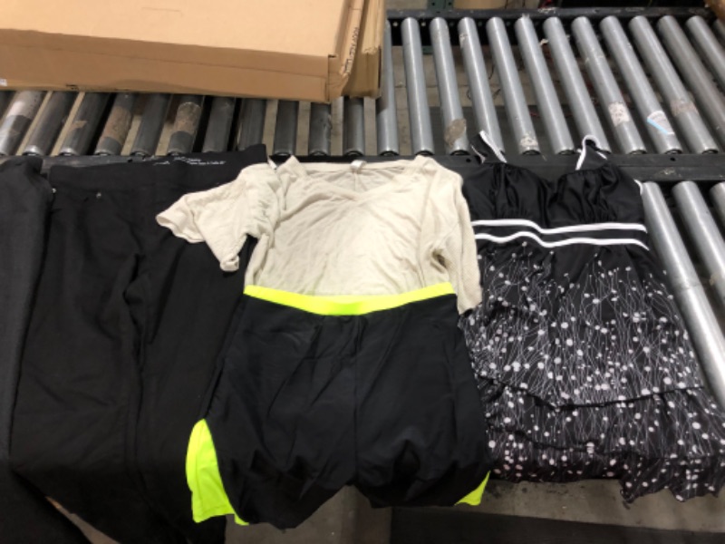 Photo 1 of Women's XL and L  clothing including swim suits and underwear.