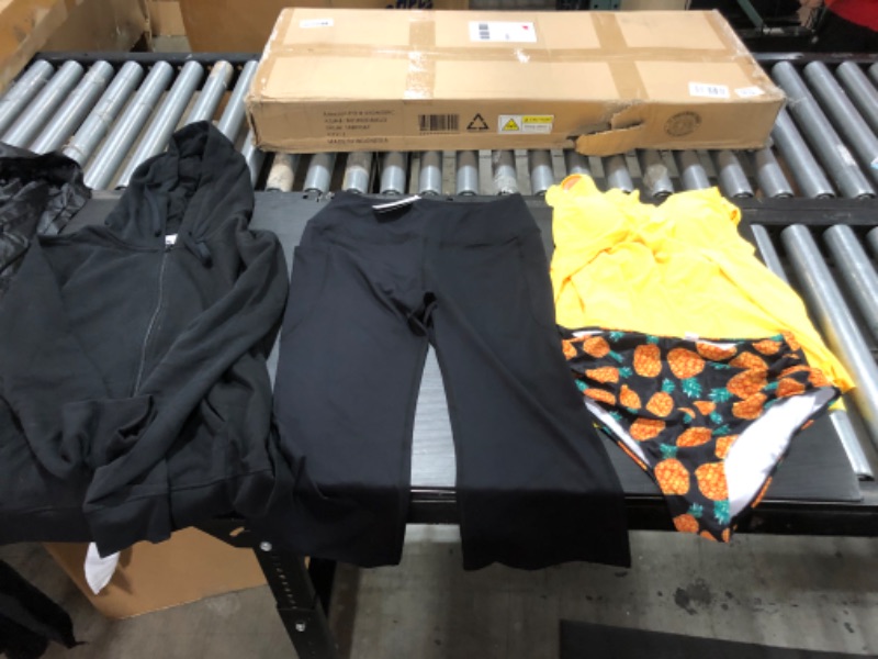 Photo 3 of Women's XL and L clothing including swim suits.