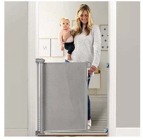 Photo 1 of Momcozy Retractable Baby Gate, Extra Wide Baby Safety Gates, Stairs Safe Gates for Baby and Pet,33" X 55", for Stairs, Doorways, Hallways
