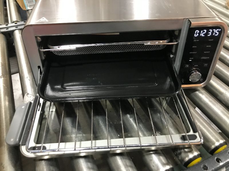 Photo 3 of Ninja SP101 Digital Air Fry Countertop Oven with 8-in-1 Functionality, Flip Up & Away Capability for Storage Space, with Air Fry Basket, Wire Rack & Crumb Tray, Silver
