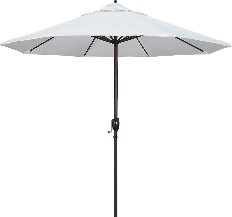 Photo 1 of California Umbrella 9' Round Aluminum Market Umbrella, Crank Lift, Auto Tilt, Bronze Pole, White Olefin
