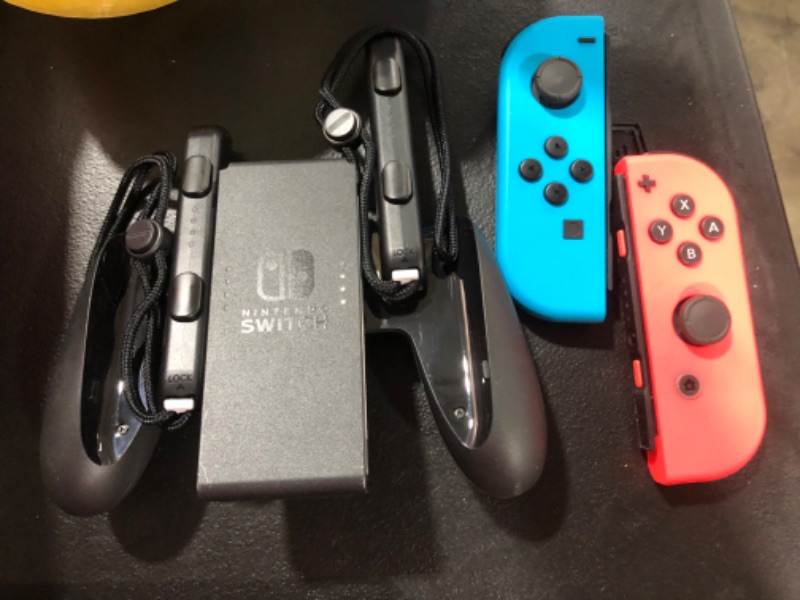 Photo 3 of Nintendo Switch with Neon Blue and Neon Red Joy?Con
