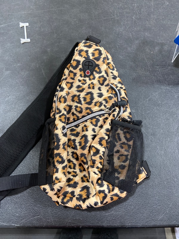 Photo 2 of MOSISO Sling Backpack,Travel Hiking Daypack Leopard Print Rope Crossbody Bag
