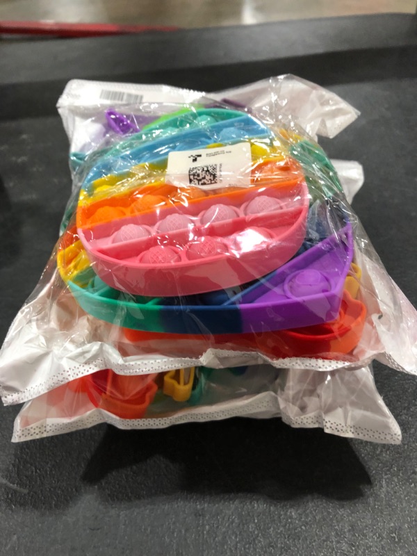 Photo 1 of 2pk of rainbow fidget toys 