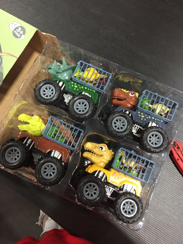 Photo 1 of DINOSAUR TOY TRUCKS 