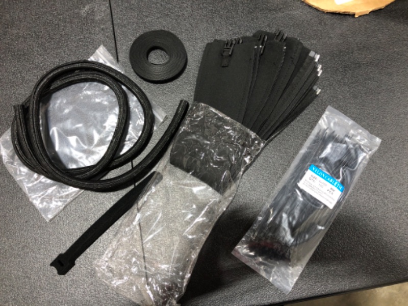 Photo 2 of 117 PCS Cable/Cord Management Kit, 5 x Cable Sleeve with Zipper, 1 x 1.5m Roll Cable Sleeve Cover, 10pcs and 1 x Roll Self Adhesive tie, 100 x Fastening Cable Ties for Home and Office