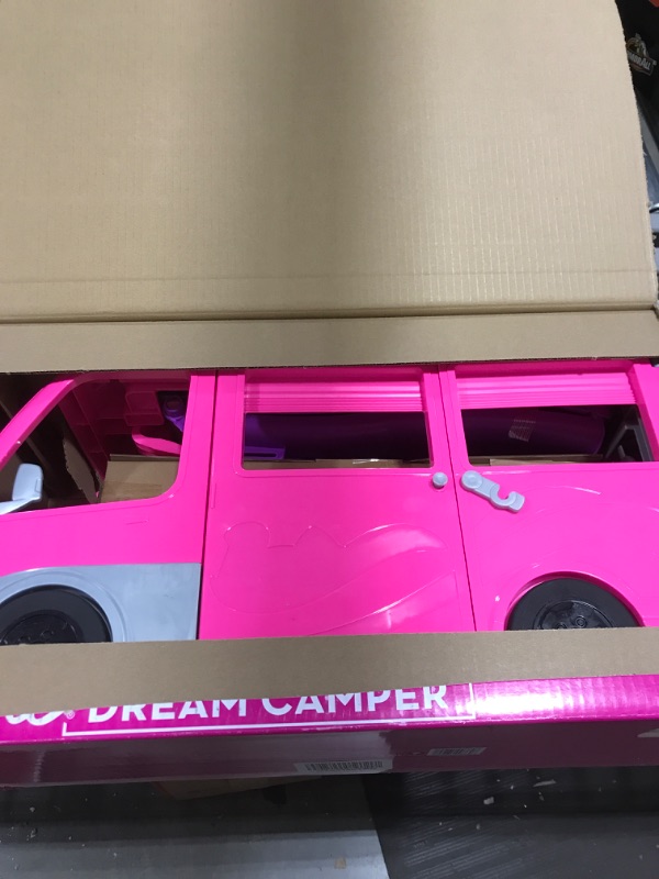 Photo 1 of Barbie Camper, DreamCamper Toy Playset with 60+ Barbie Accessories and Furniture Pieces, 7 Play Areas Including Pool and Slide