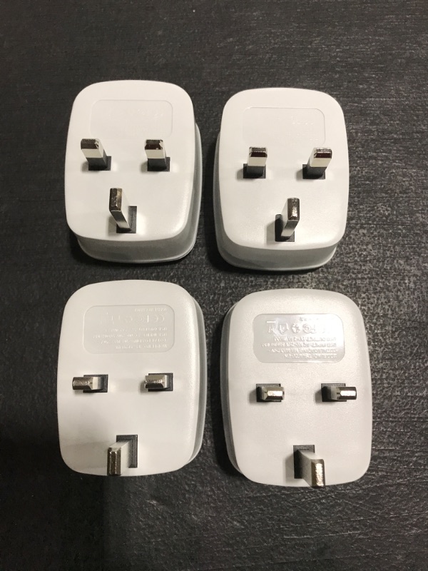 Photo 1 of LOT OF 4 - UK Ireland Hong Kong Power Adapter, TESSAN International Travel Plug with 2 USB, Type G Outlet Adaptor Charger for USA to British England Scotland Irish Qatar London. PRIOR USE. 
