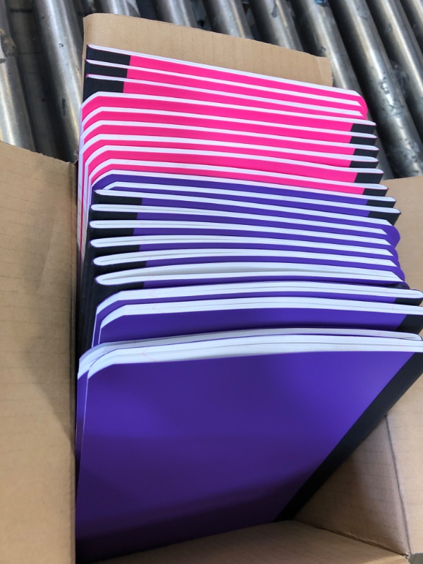 Photo 1 of 23 pk of purple and pink notebooks.