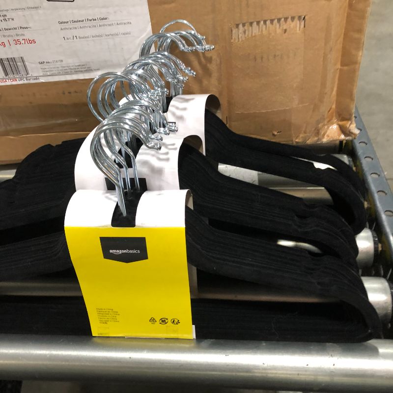 Photo 2 of Amazon Basics Slim, Velvet, Non-Slip Suit Clothes Hangers, Black/Silver - Pack of 99
59 unpacked - 40 packaged. 
