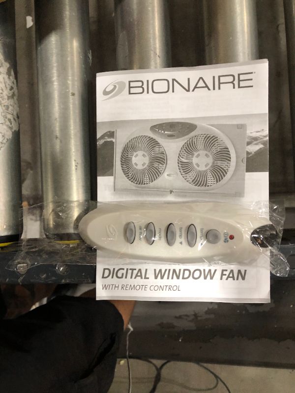 Photo 3 of Bionaire Window Fan with Twin 8.5-Inch Reversible Airflow Blades and Remote Control, White
