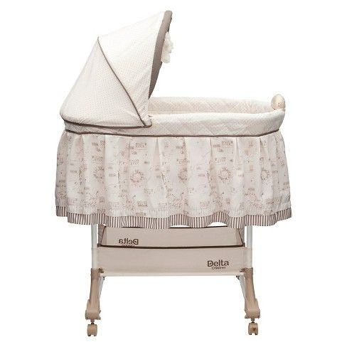 Photo 1 of Delta Children Playtime Jungle Rocking Bassinet