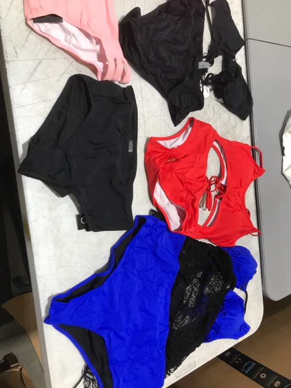 Photo 3 of BAG OF WOMENS SWIMSUITS -- SIZES VARY 