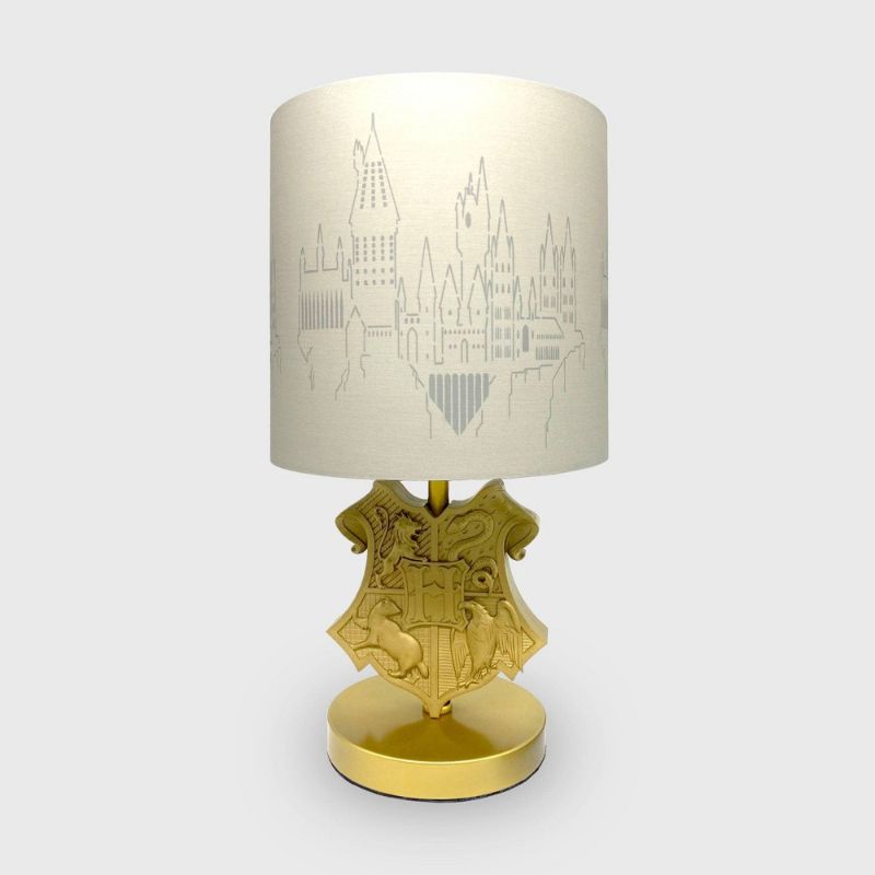 Photo 1 of - MAJOR DAMAGE TO LAMP SHADE - BENT - Harry Potter Crest Table Lamp (Includes LED Light Bulb)
