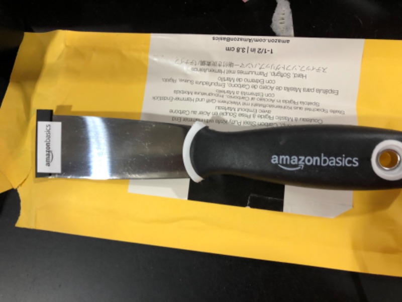 Photo 2 of Amazon Basics 1-1/2" Stiff, Soft Grip, Carbon Steel Putty Knife with Hammer End
