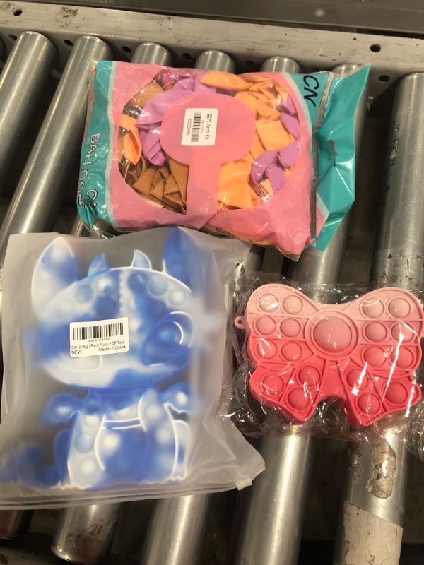 Photo 1 of Balloons and fidget popper toys