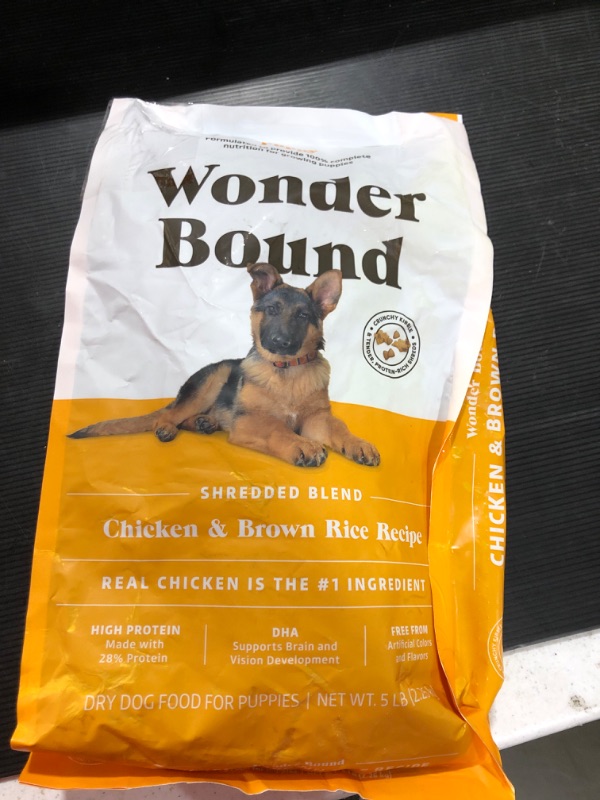 Photo 2 of Amazon Brand - Wonder Bound High Protein, Dry Puppy Food - Chicken & Brown Rice Recipe, 5 Lb Bag ripped bag. Best by 08/2022
