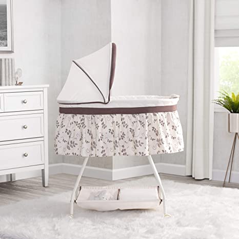 Photo 1 of Delta Children Deluxe Sweet Beginnings Bedside Bassinet - Portable Crib with Lights and Sounds, Falling Leaves