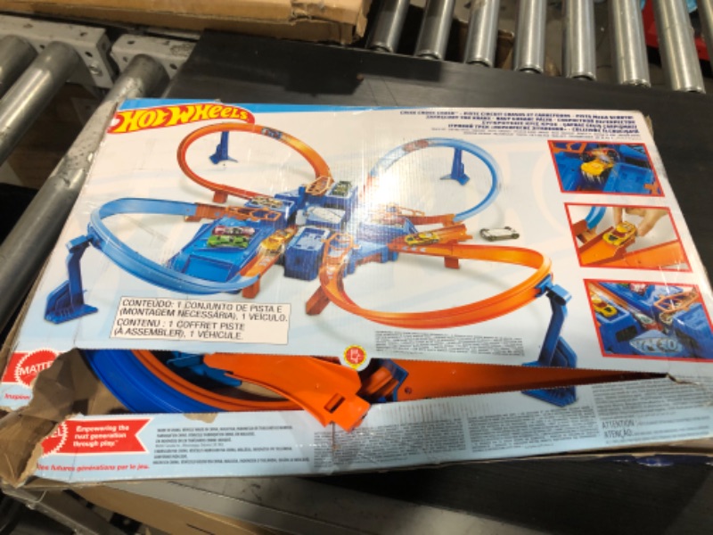 Photo 2 of Hot Wheels Track Set with 1:64 Scale Toy Car, 4 Intersections for Crashing, Powered by a Motorized Booster, Criss-Cross Crash Track????