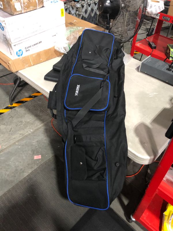 Photo 6 of (STOCK PHOTO FOR SAMPLE ONLY) - Golf Travel Bags for Airlines with Wheels, Padded Around Top Golf Bag Travel Case for Clubs Protection - (BLUE AND BLACK) 