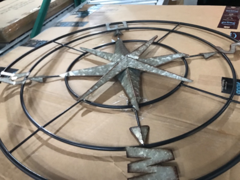 Photo 1 of *** DAMAGED PARTS OF STAR BENT AND PARTS ON LETTERS BENT ****Deco 79 Metal Compass Indoor Outdoor Wall Decor with Distressed Copper Like Finish, 32" x 2" x 32", Gray Grey