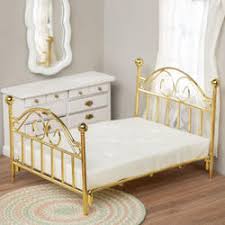Photo 1 of * USED * 
GOLD METAL DOLL BED 