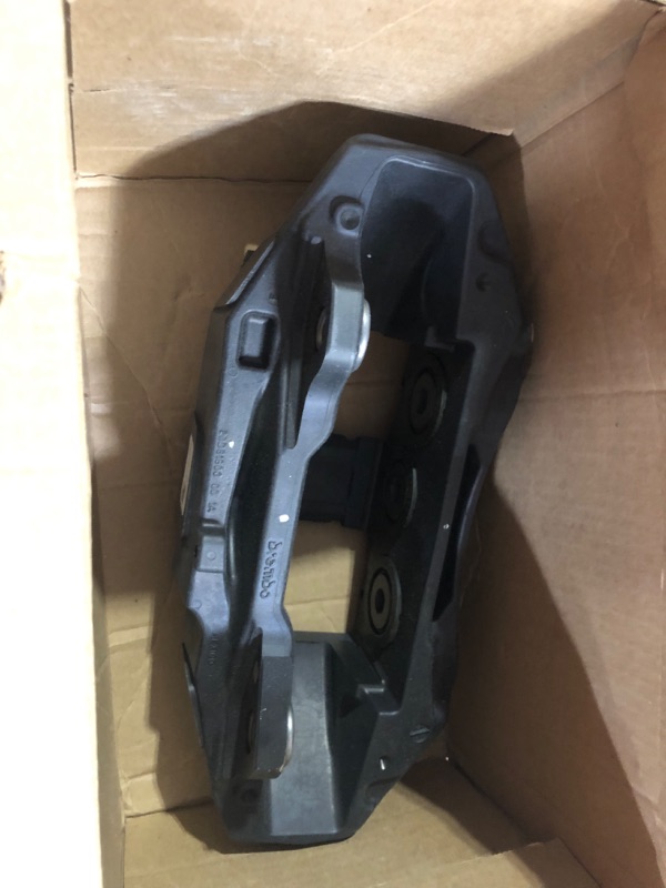 Photo 2 of GM Genuine Parts 84793057 Front Driver Side Disc Brake Caliper without Pads and Bracket