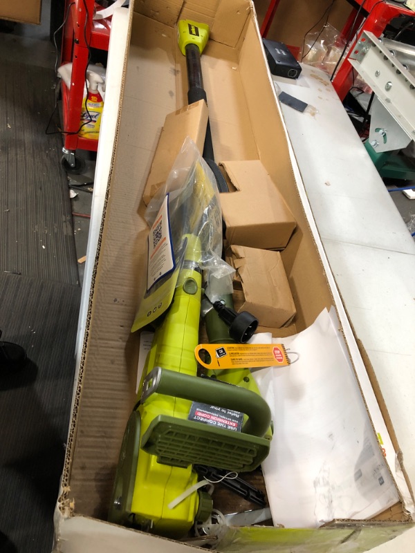 Photo 2 of **USED** UNABLE TO TEST**OIL LEAKED IN BOX**  Sun Joe 2-in-1 Electric Convertible Pole Chain Saw 8 inch 8.0 Amp (Green)