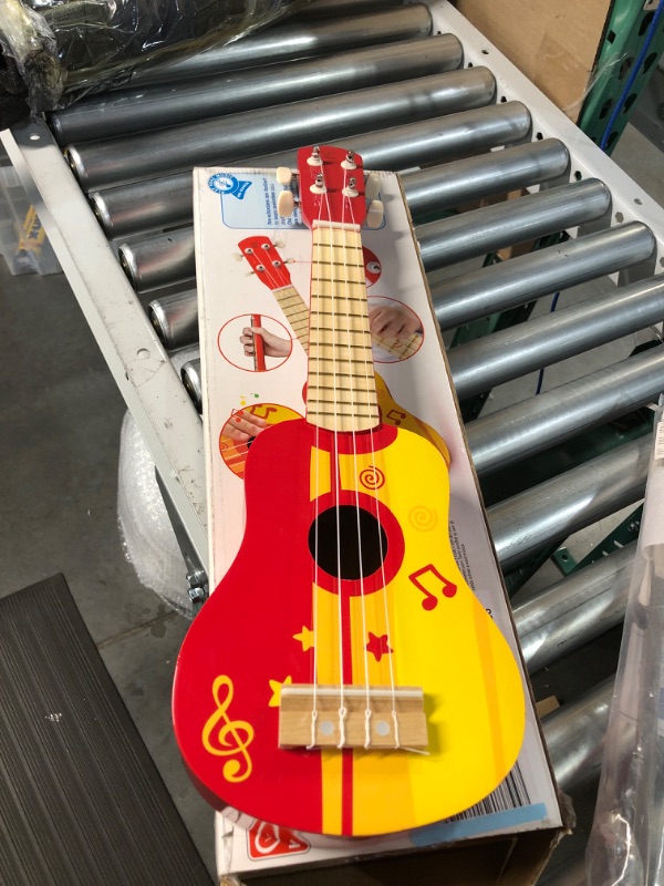 Photo 2 of **USED/SEE NOTES ** Hape Kid's Wooden Toy Ukulele in Red, L: 21.9, W: 8.1, H: 3 inch