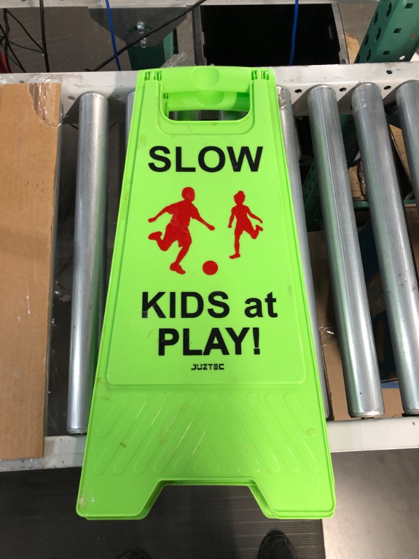 Photo 3 of Slow Kids at Play Sign, with Double-Sided Text and Graphics for Street Neighborhoods (2-Pack Green)