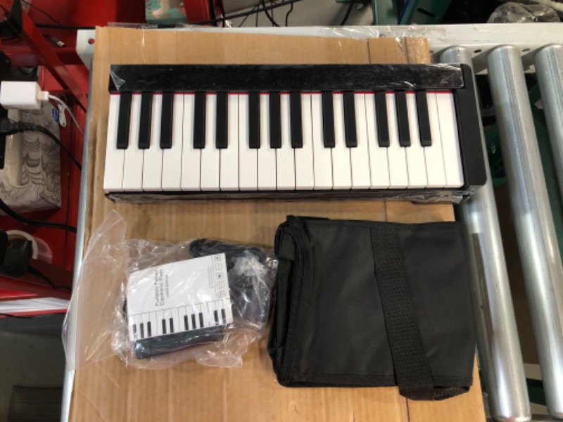 Photo 2 of ***UNTESTED*** KONIX 61 Key Folding Piano Keyboard, and Piano Bag PJ61B