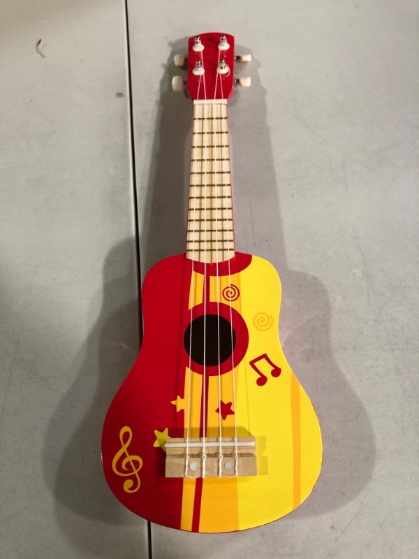 Photo 2 of Hape Kid's Wooden Toy Ukulele in Red, L: 21.9, W: 8.1, H: 3 inch