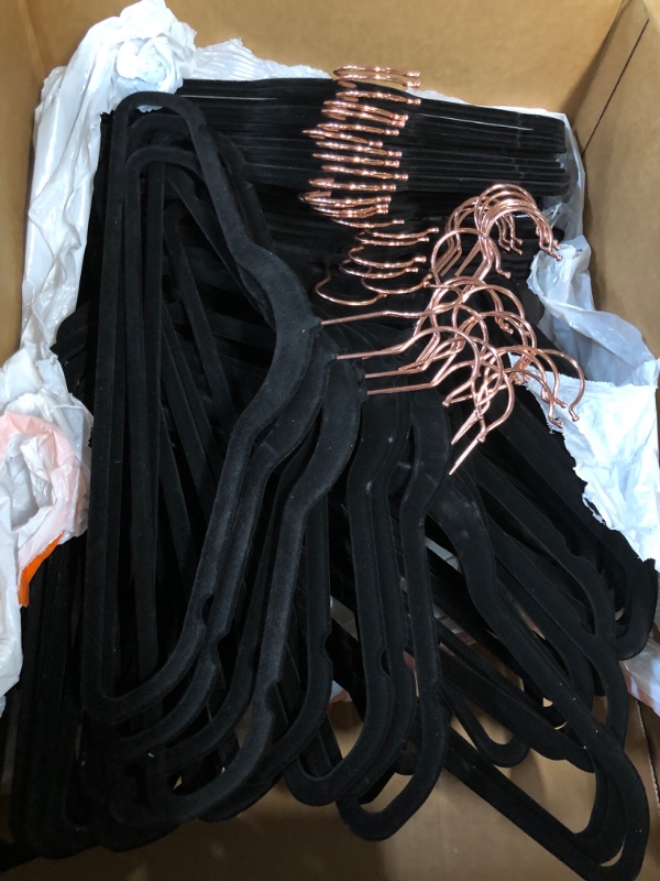 Photo 2 of -USED- Amazon Basics Slim, Velvet, Non-Slip Suit Clothes Hangers, Black/Rose Gold - Pack of 100 
