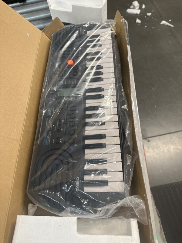 Photo 1 of **SEE NOTES** Casio, 44-Key SA-77 44 Key Mini Personal Keyboard, 44 Key GRAY SA-77 Keyboard, 1 Count