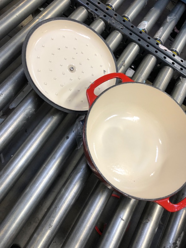 Photo 2 of Amazon Basics Enameled Cast Iron Covered Dutch Oven, 6-Quart, Red & Silicone, Non-Stick, Food Safe Baking Mat -------minor scuff on the lid and the handle --------missing mats 