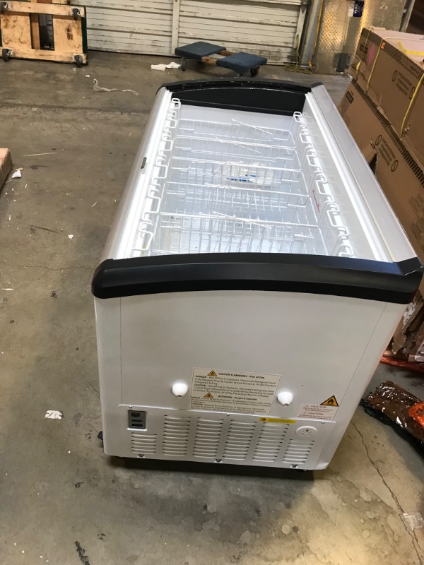 Photo 7 of DUURA DDFC15 Commercial Mobile Ice Cream Display Chest Freezer Sub Zero Temp Curved Glass Top Frost Free Lid with 6 Wire Baskets, 53.2 Inch Wide 15.2 Cubic Feet, White----------THE FREEZER SLIDING DOORS ARE BROKEN NEEDS REPLACEING AND THERE IS A SMALL DEN