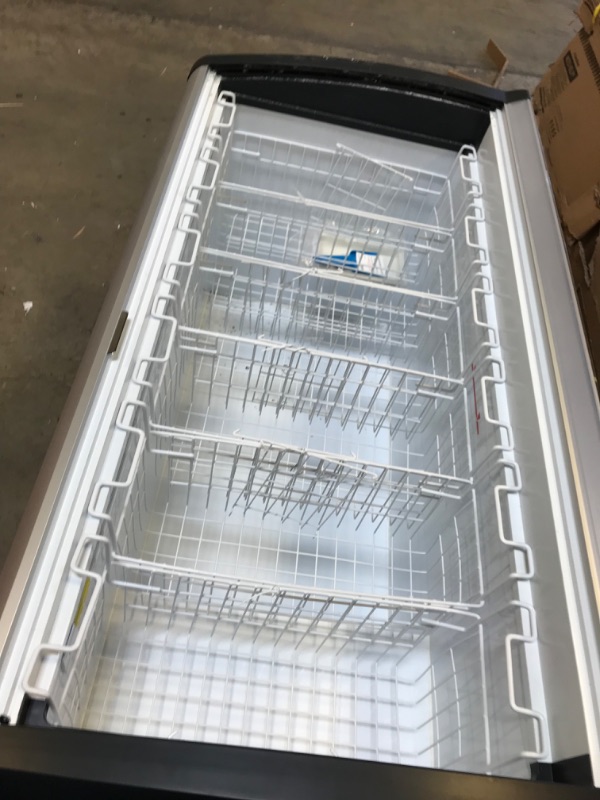 Photo 5 of DUURA DDFC15 Commercial Mobile Ice Cream Display Chest Freezer Sub Zero Temp Curved Glass Top Frost Free Lid with 6 Wire Baskets, 53.2 Inch Wide 15.2 Cubic Feet, White----------THE FREEZER SLIDING DOORS ARE BROKEN NEEDS REPLACEING AND THERE IS A SMALL DEN