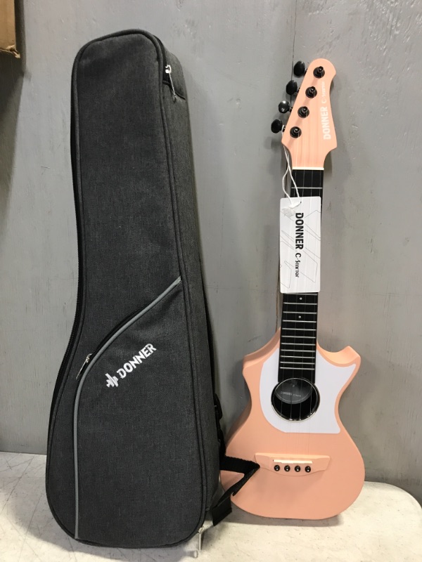 Photo 1 of Donner Ukulele Pink Carbon Fiber LP 23 Inch Travel Starter Bundle Kit with Free Online Lesson Gig Bag Strap Nylon String Tuner Picks Cloth DCF-200...
