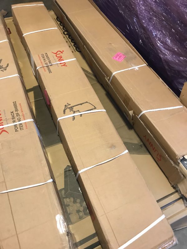 Photo 1 of Sunny Health & Fitness Power and Squat Rack with High Weight Capacity, Olympic Weight Plate Storage and 360° Swivel Landmine and Power Band Attachment -- FACTORY STRAPPED / SEALED
