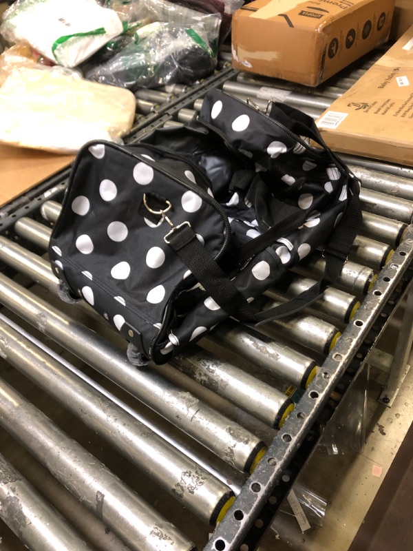 Photo 1 of Black polca dot duffle bag with wheels 