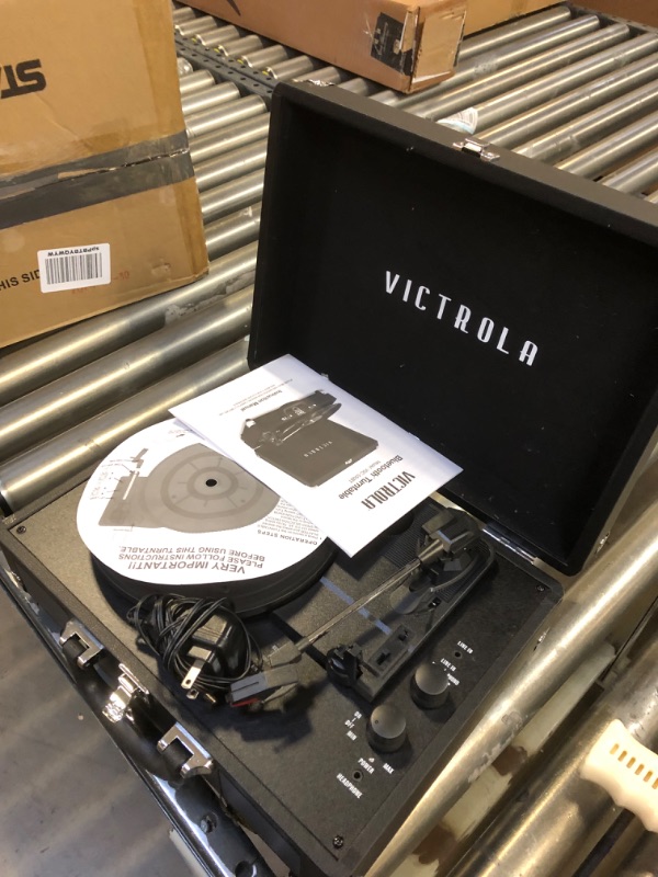 Photo 2 of Victrola Vintage 3-Speed Bluetooth Portable Suitcase Record Player with Built-in Speakers | Upgraded Turntable Audio Sound| Includes Extra Stylus | Black, Model Number: VSC-550BT-BK, 1SFA-----scuff on the front side of the record player 