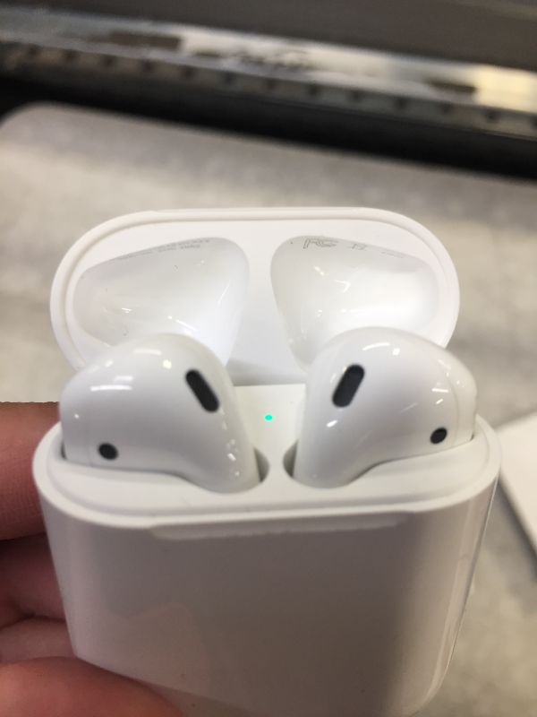 Photo 2 of Apple AirPods (2nd Generation) Wireless Earbuds with Lightning Charging Case Included. Over 24 Hours of Battery Life, Effortless Setup. Bluetooth Headphones for iPhone- 
