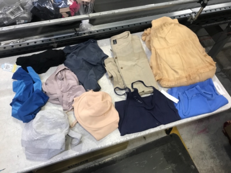 Photo 1 of 10 ITEM ASSORTED BAG LOT 
VARIES CLOTHING AND SIZES