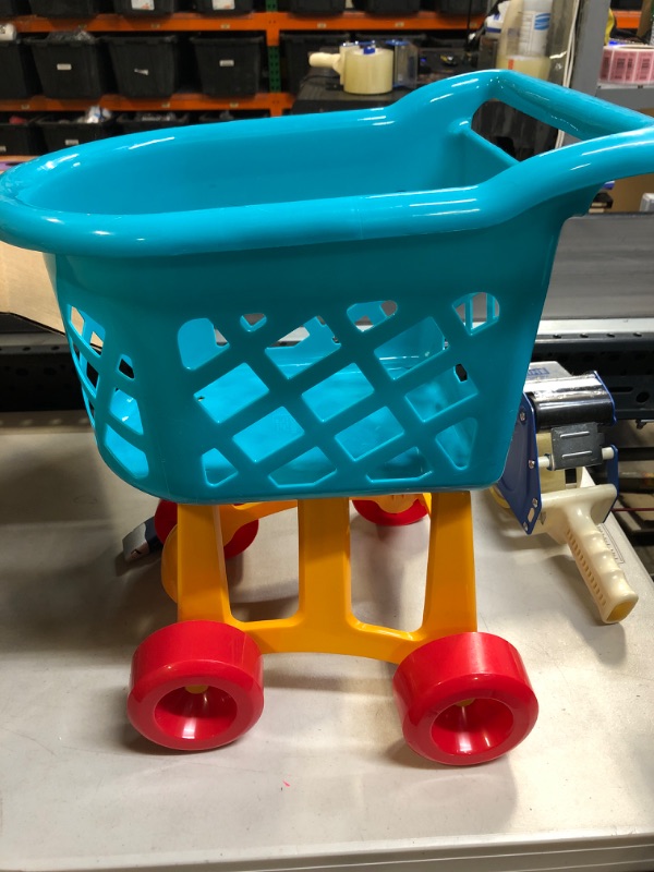 Photo 1 of childrens shopping cart and grocery items