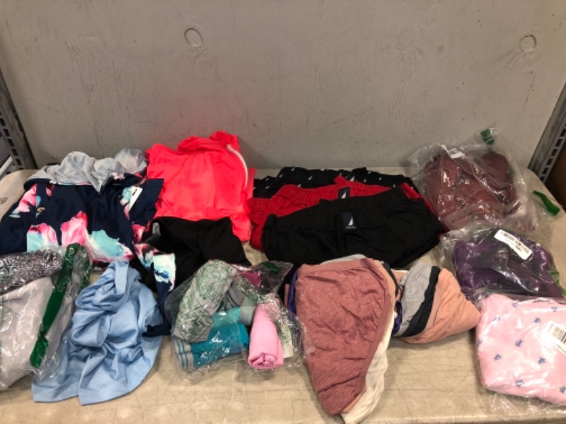 Photo 1 of Assorted Clothes Various Sizes and Styles Sold As Is